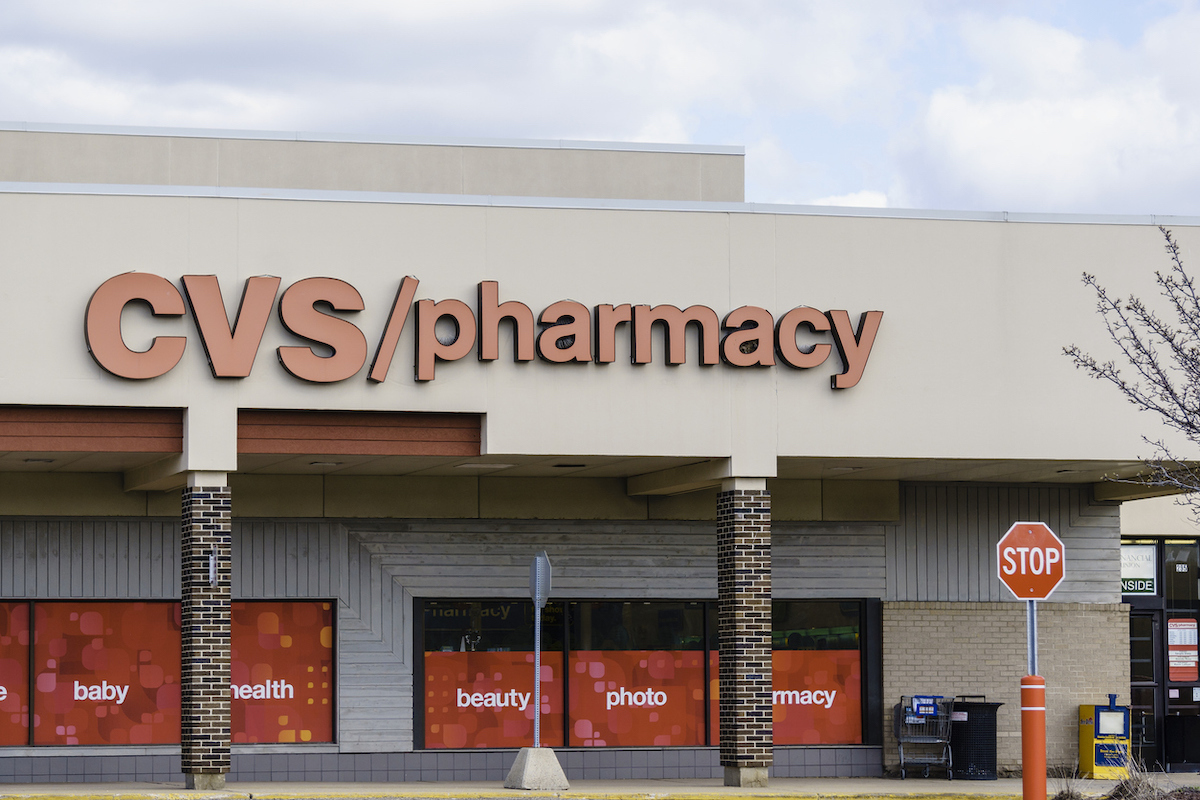 CVS Pharmacy storefront with a stop sign in front