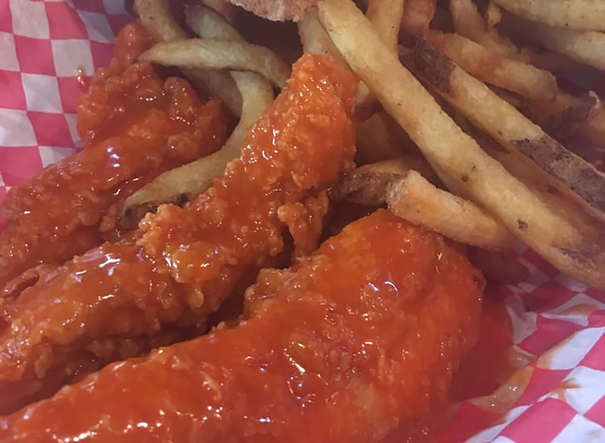 chicken fingers in hot sauce with fries