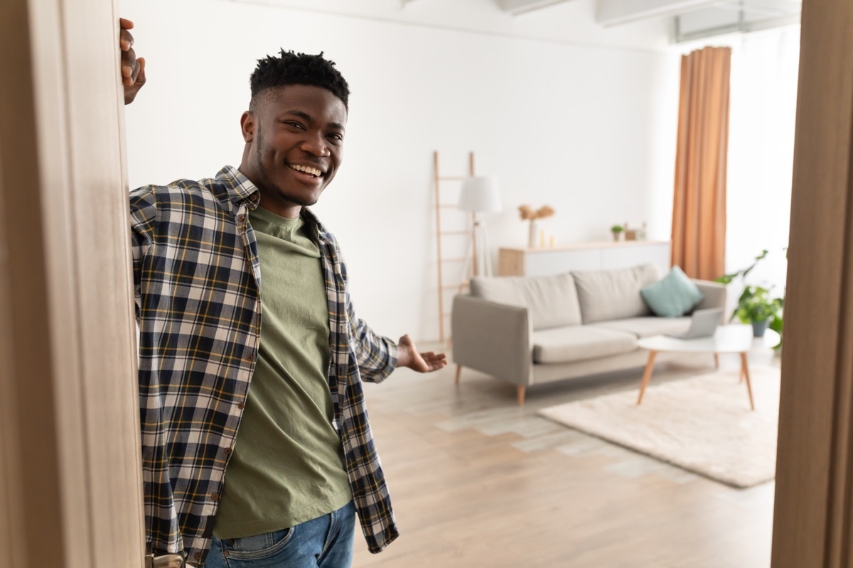 Man Opening the Door to His Home