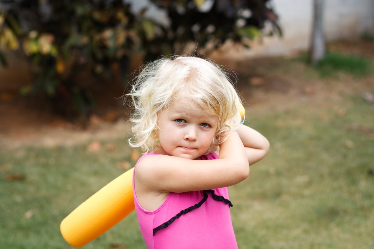 Girl with whiffle ball bat