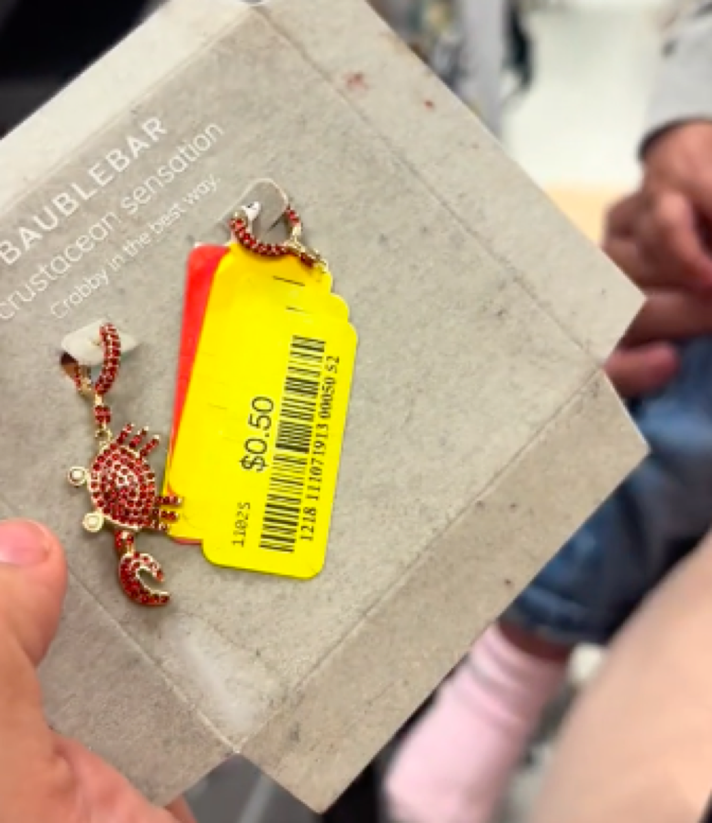 Marshalls shopper showing earrings in store that have one missing