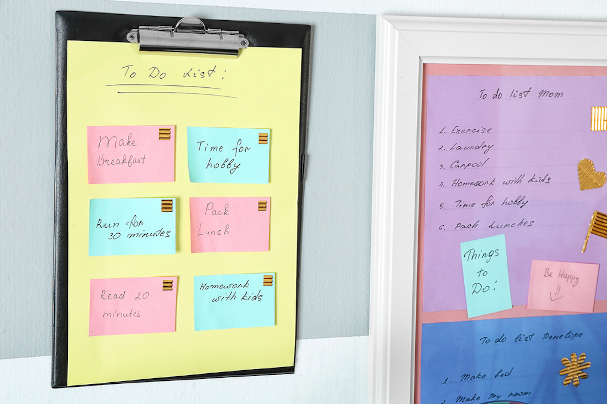 family to-do list on wall, color coded