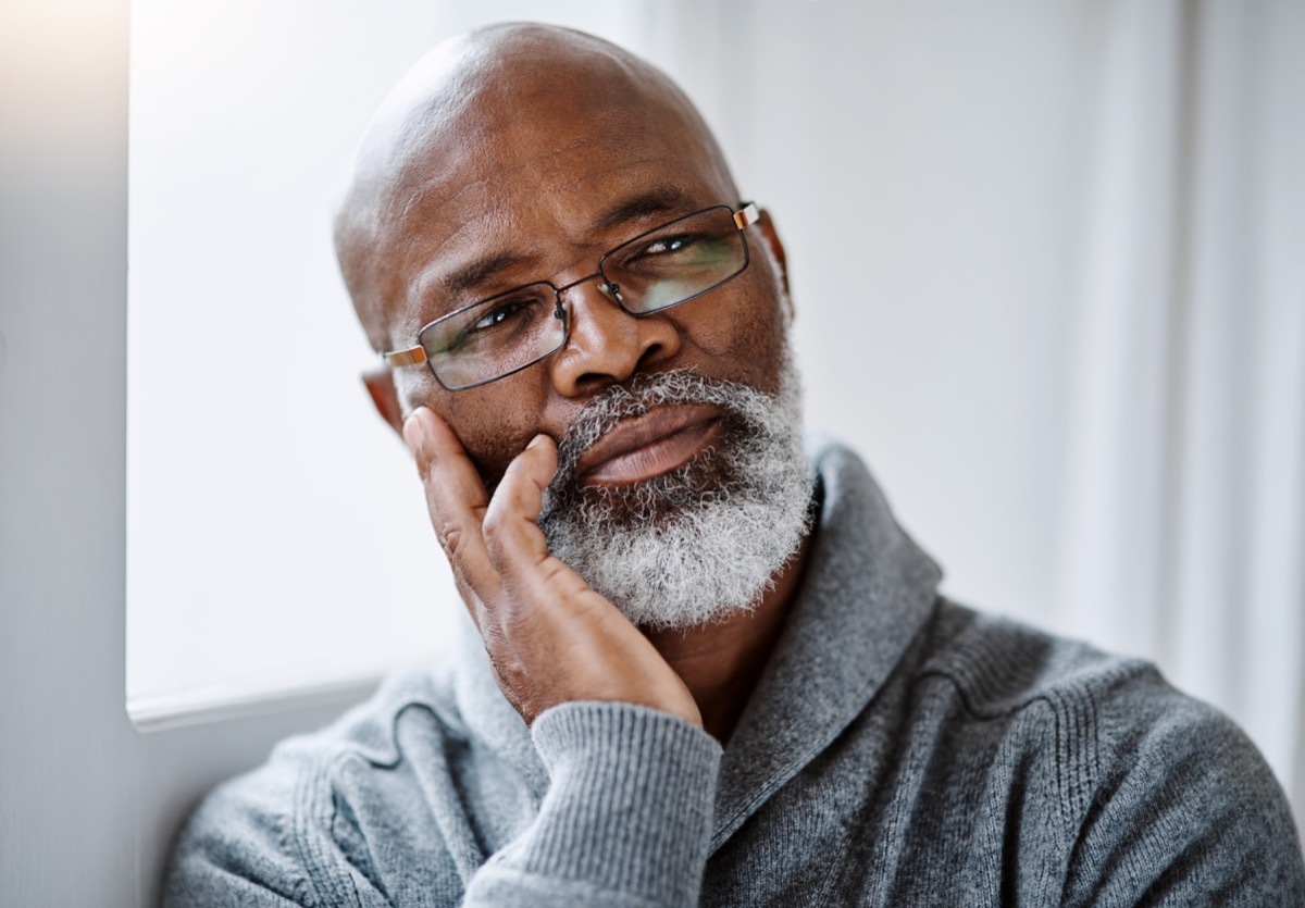 older man staring and thinking off into space