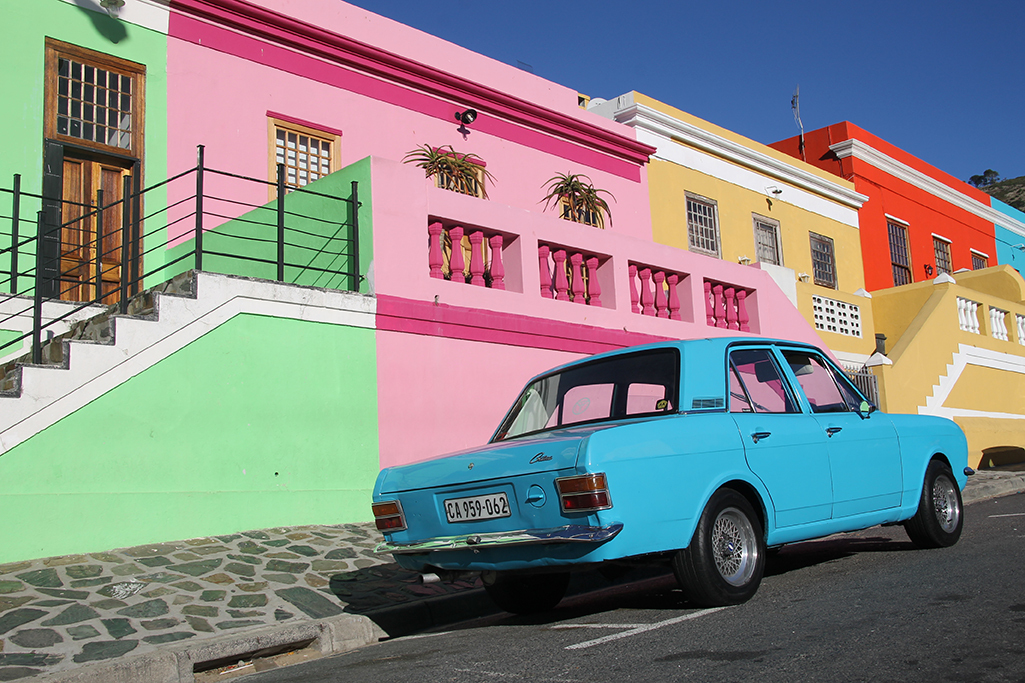 colorful street with a blue car in cape town, south africa