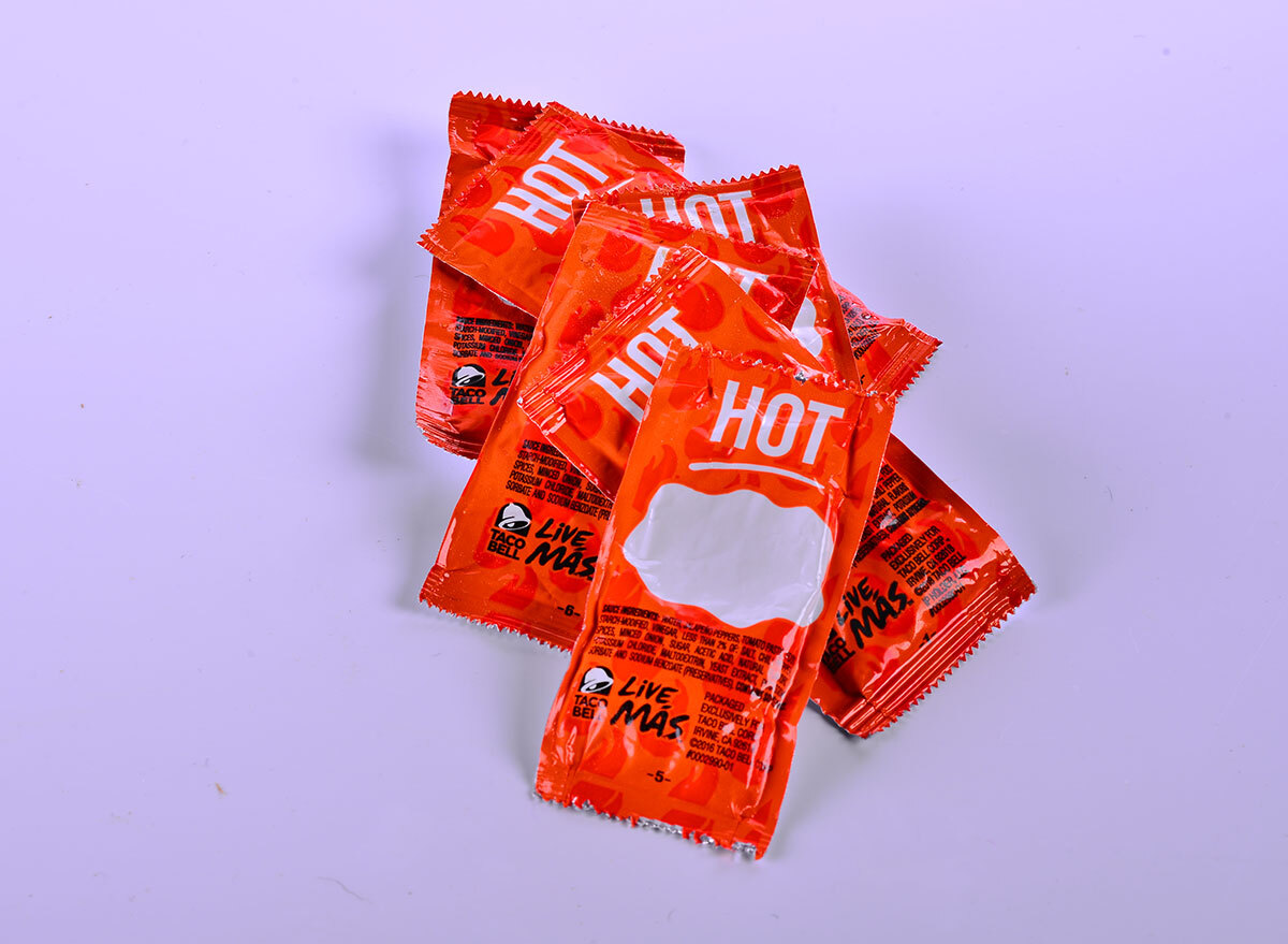 pile of taco bell hot sauce