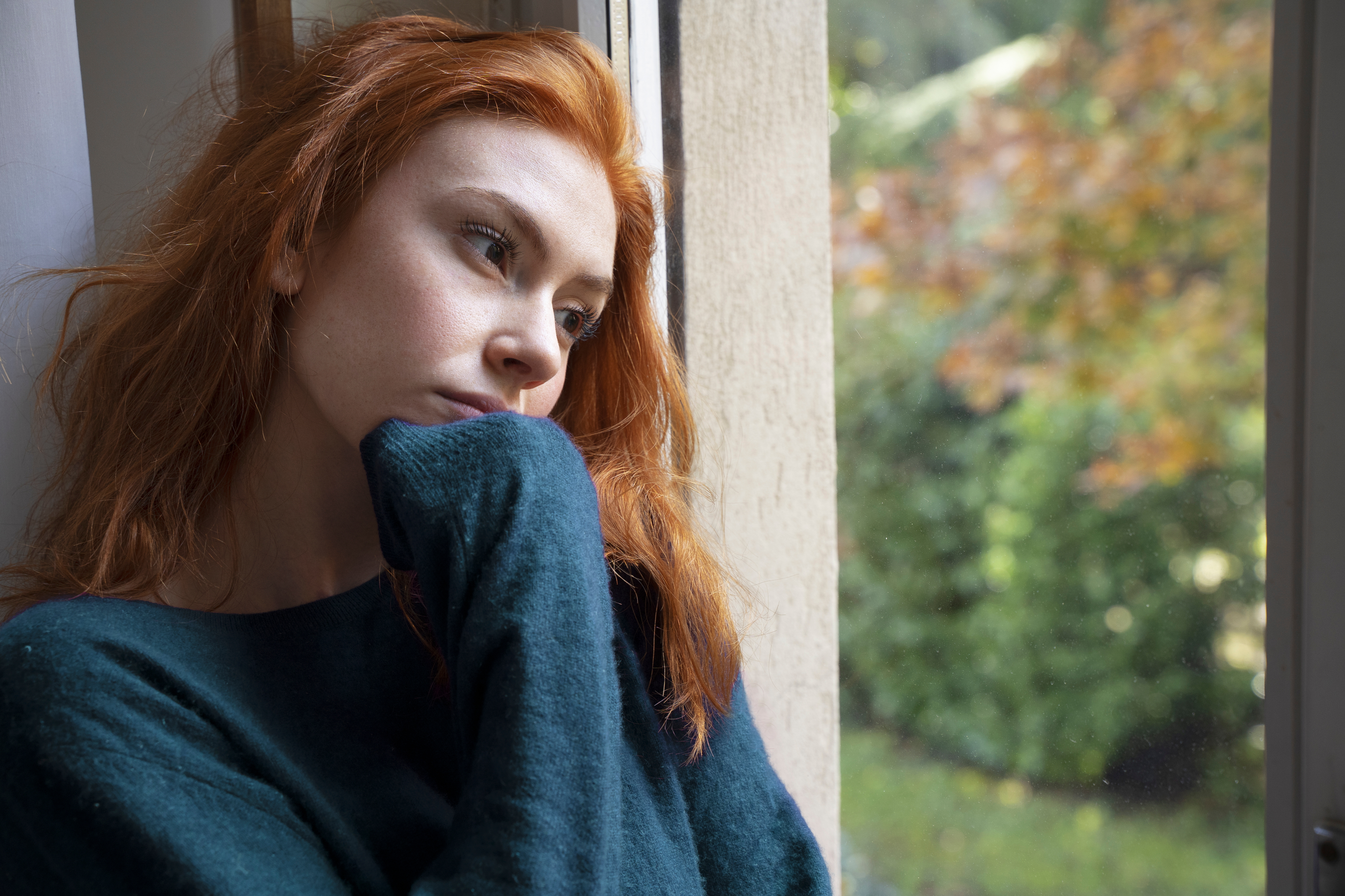 Woman looking out window