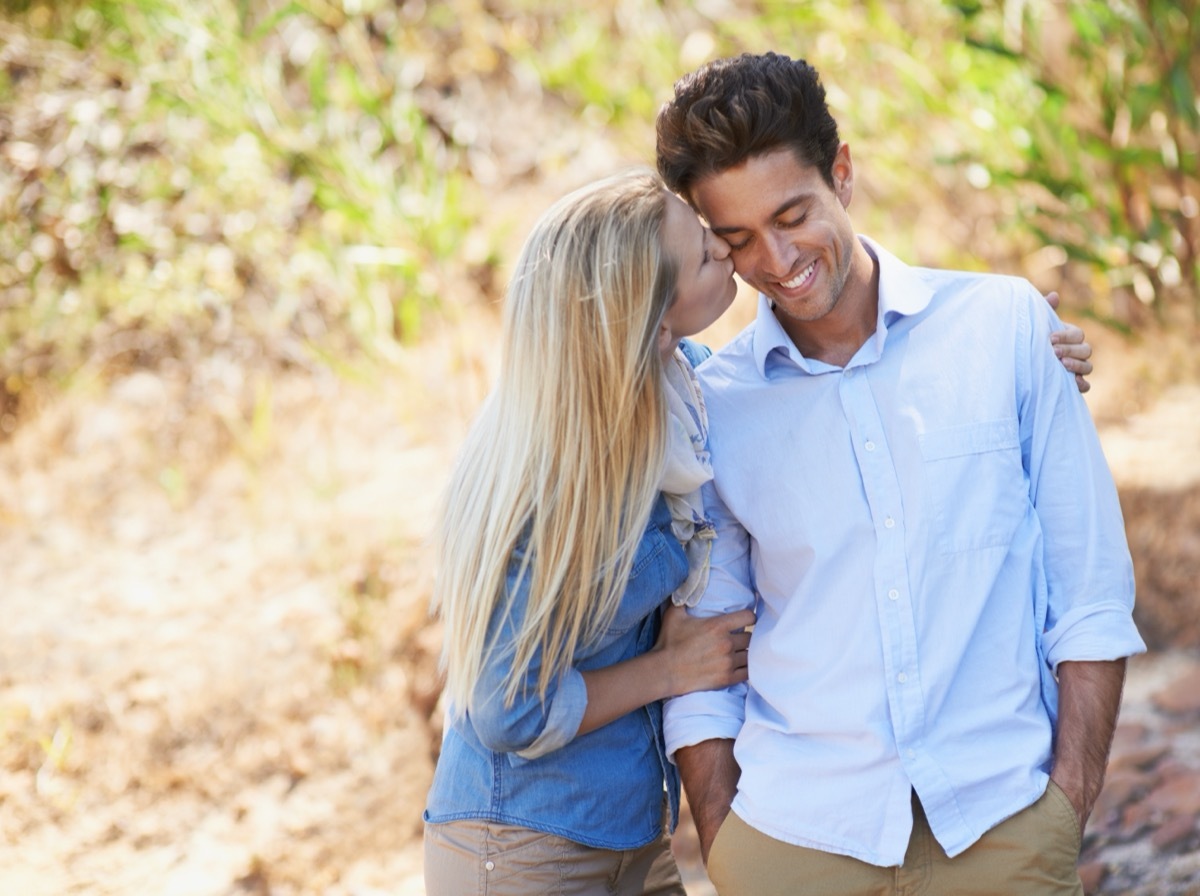 girlfriend kissing her boyfriend on the cheek