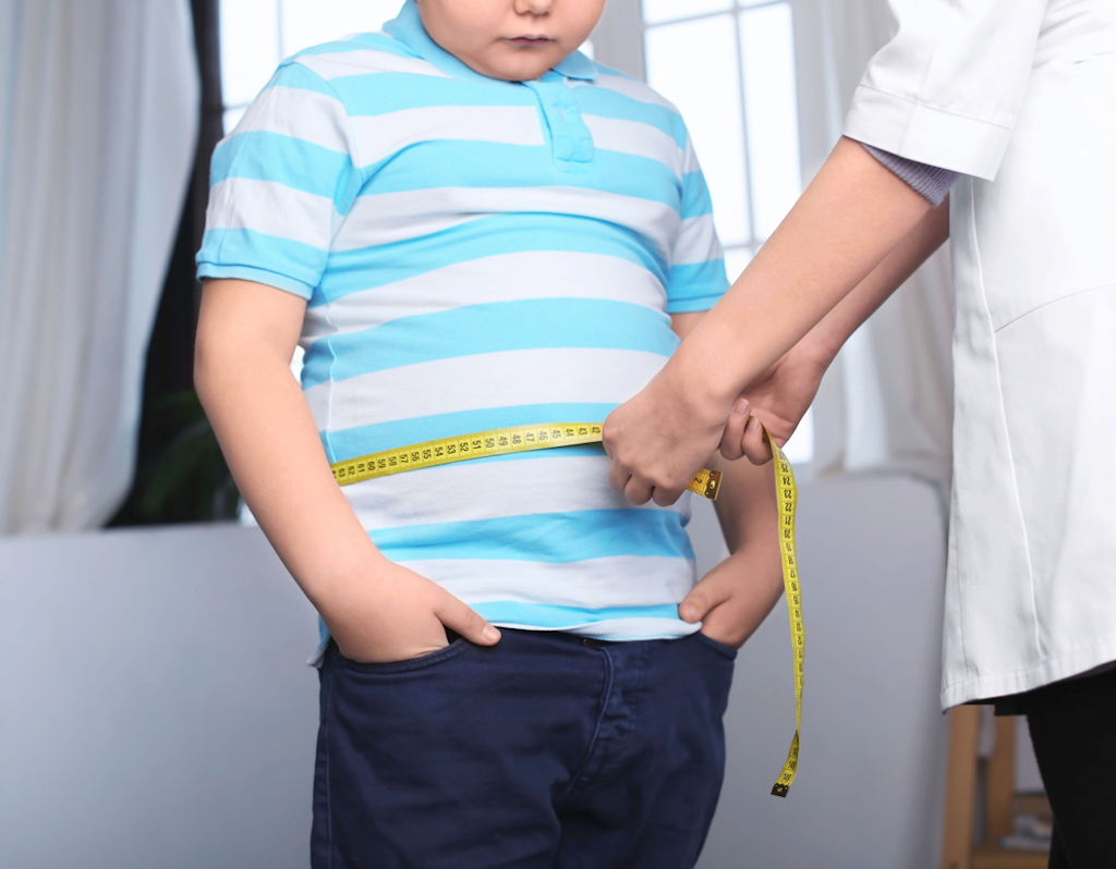 chubby boy being measured at doctor, parenting is harder