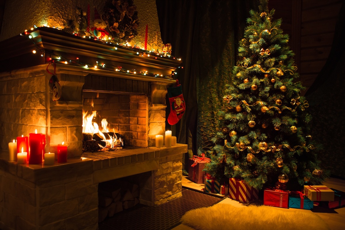 A Christmas tree decorated with ornaments and ribbon