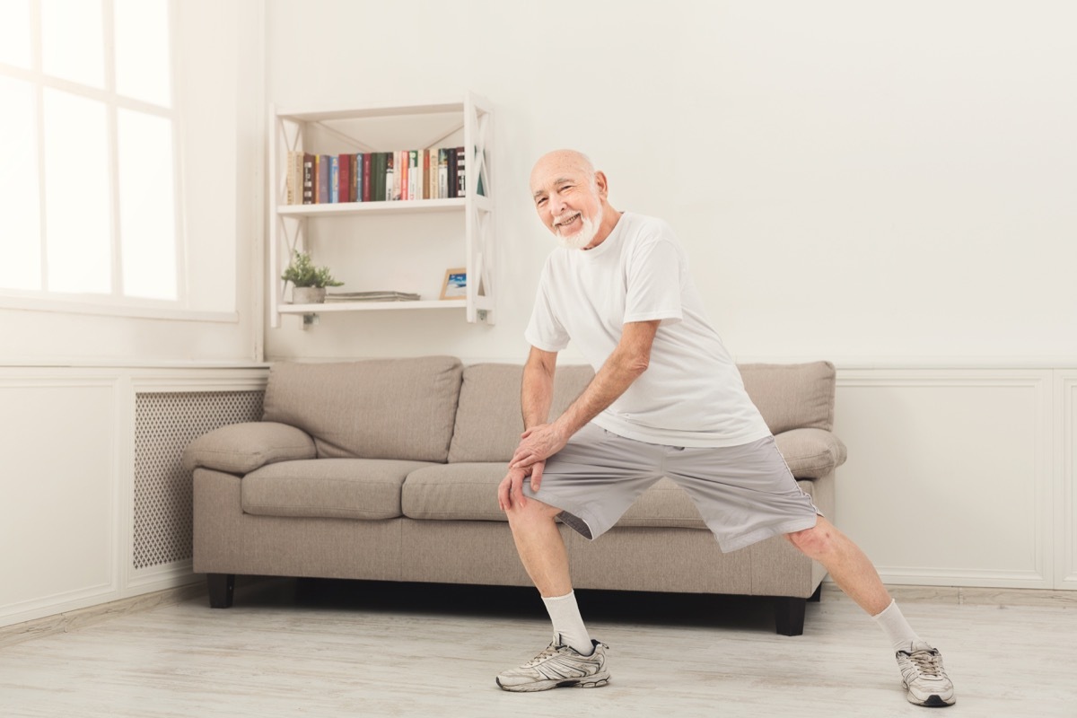 Senior man working out at home