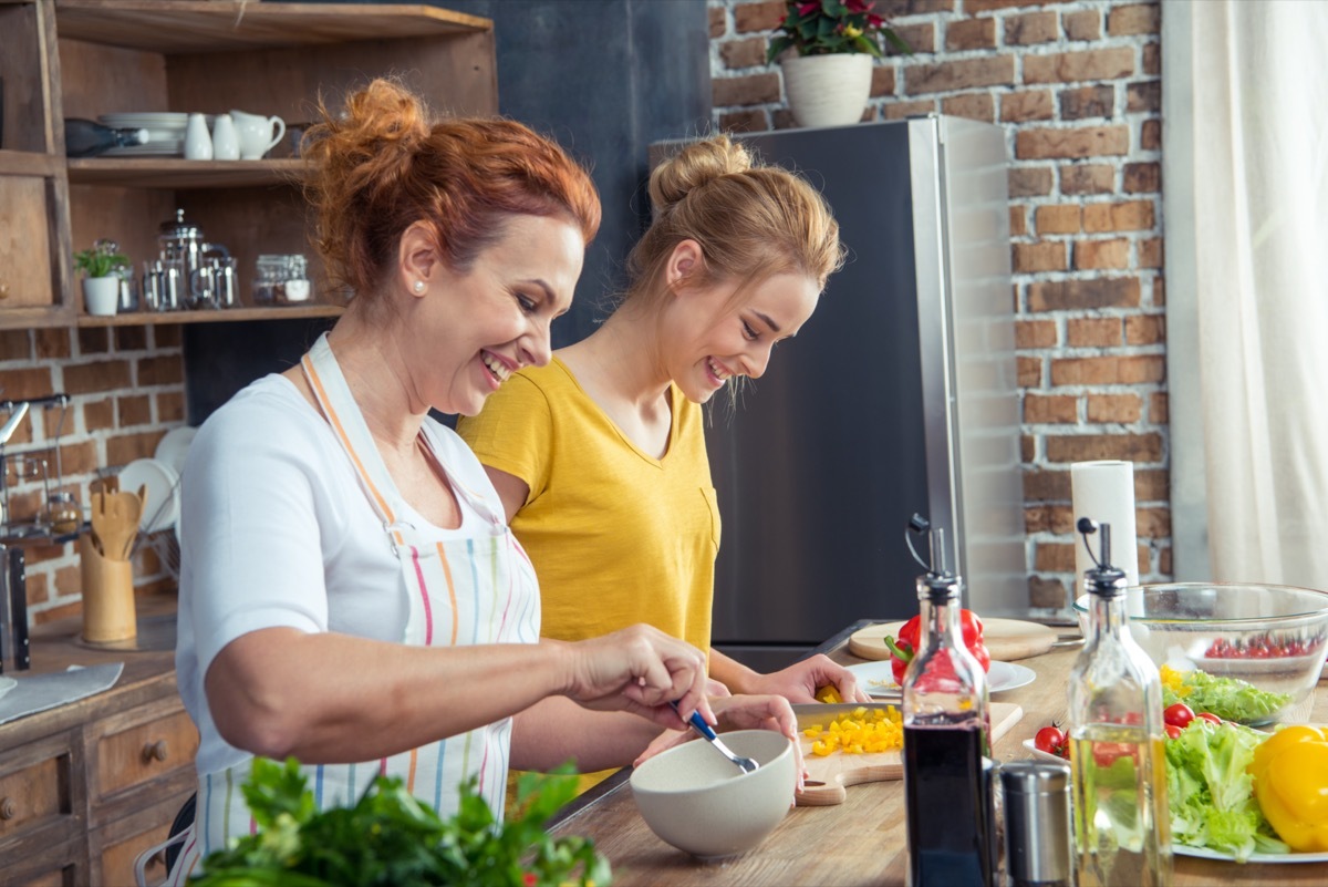 mother and daughter cooking