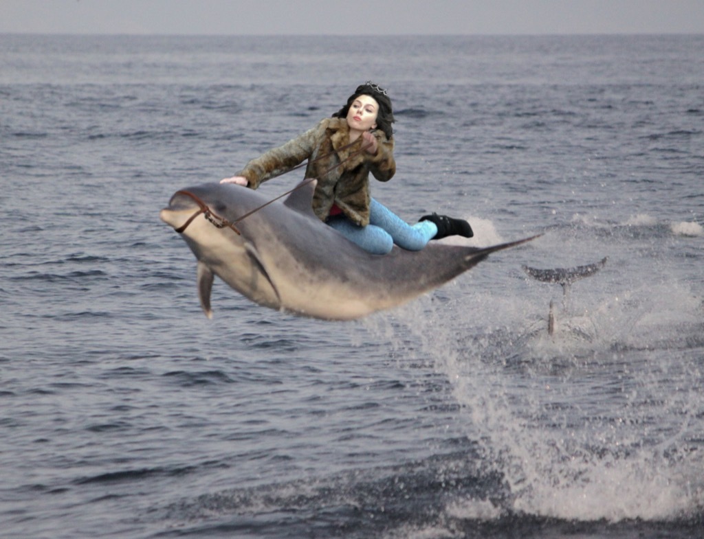 Scarlett Johansson on a dolphin