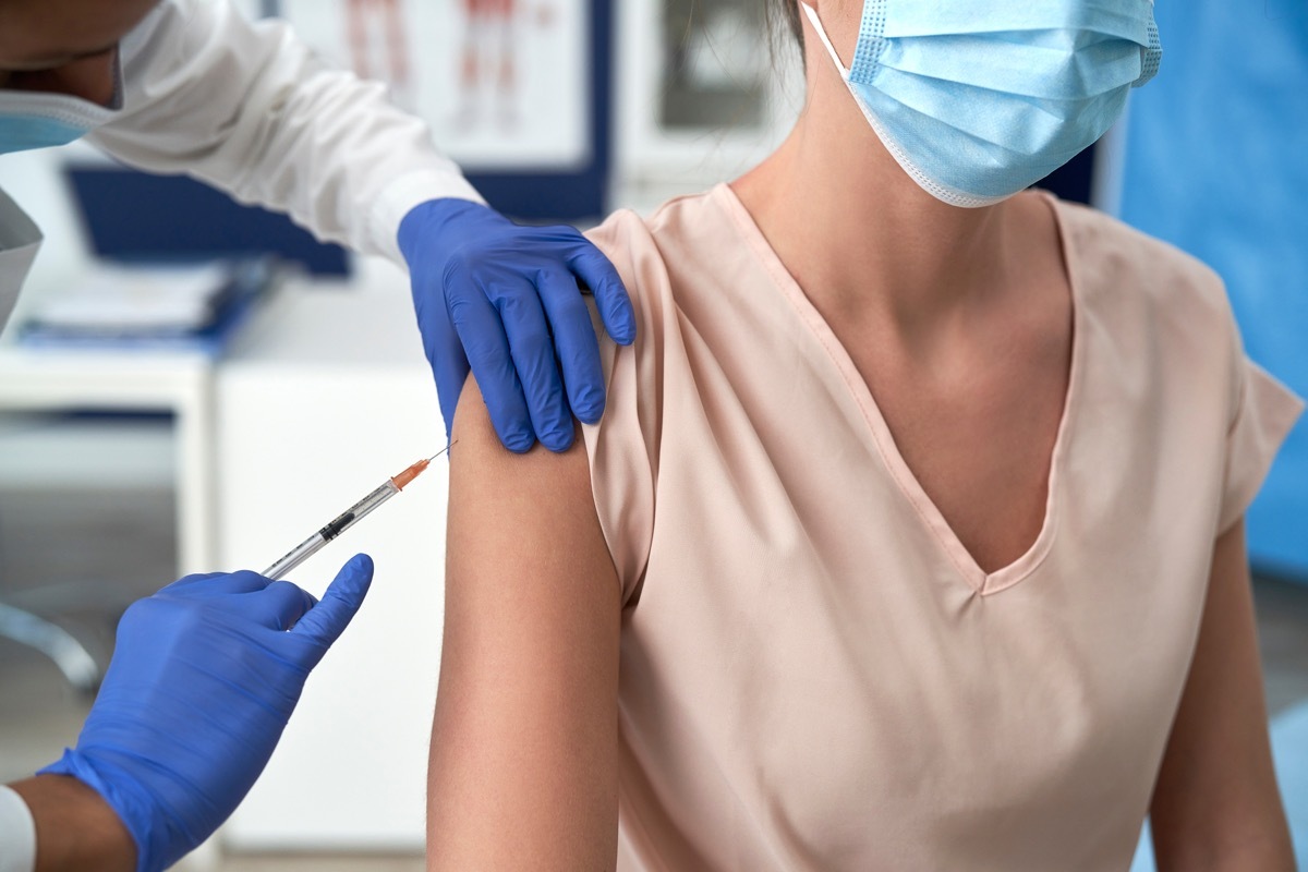 Woman getting COVID vaccine