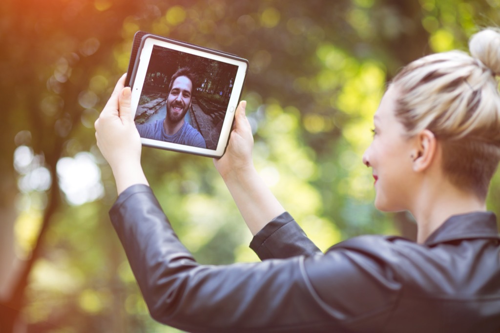 woman man ipad talking long-distance relationships, Crazy Facts You Never Knew About Your Smartphone