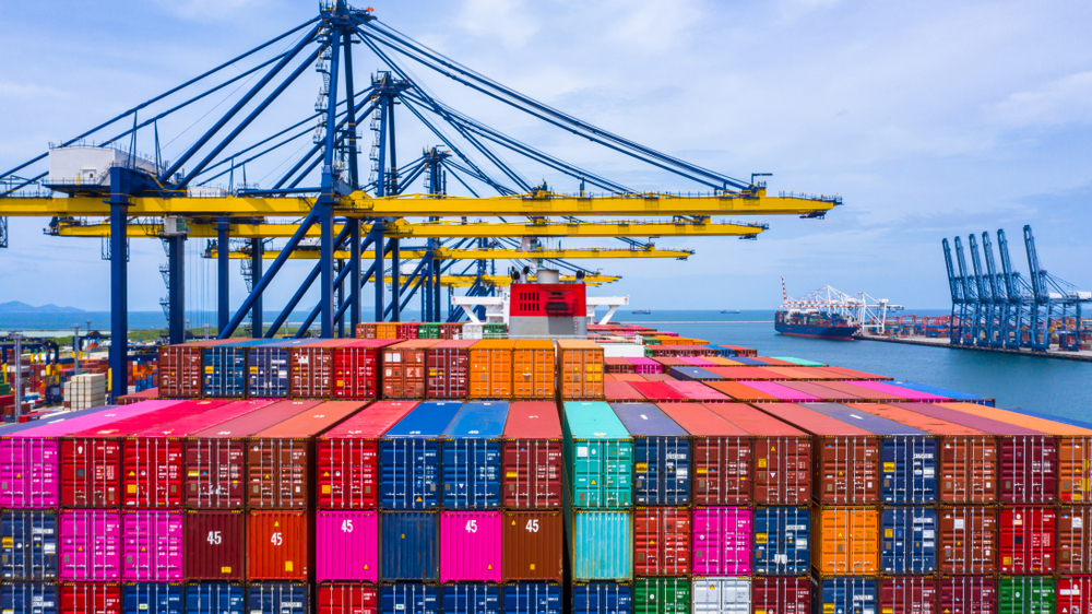 Shipping containers sitting in a port.