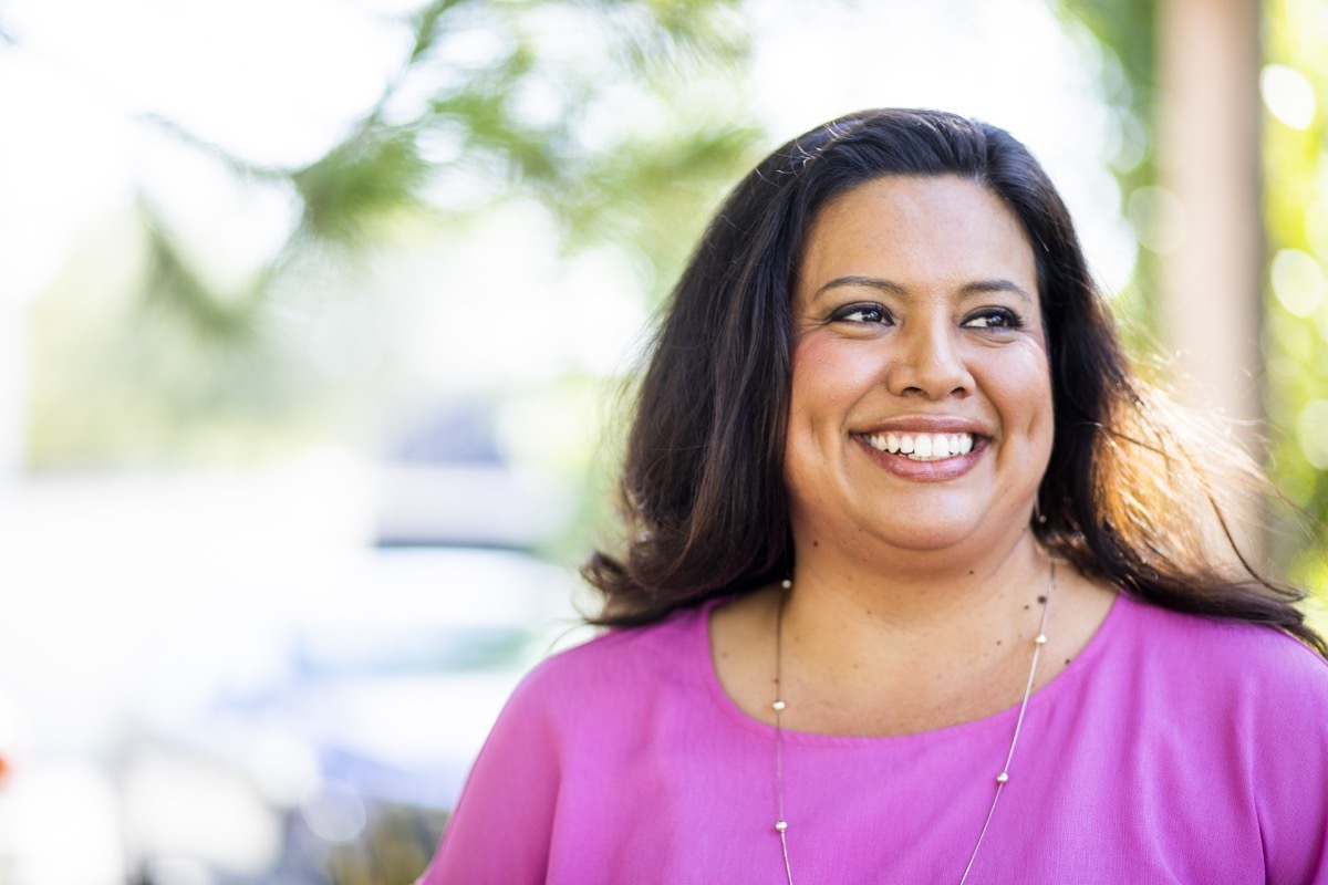 Portrait of a young hispanic woman in the park.