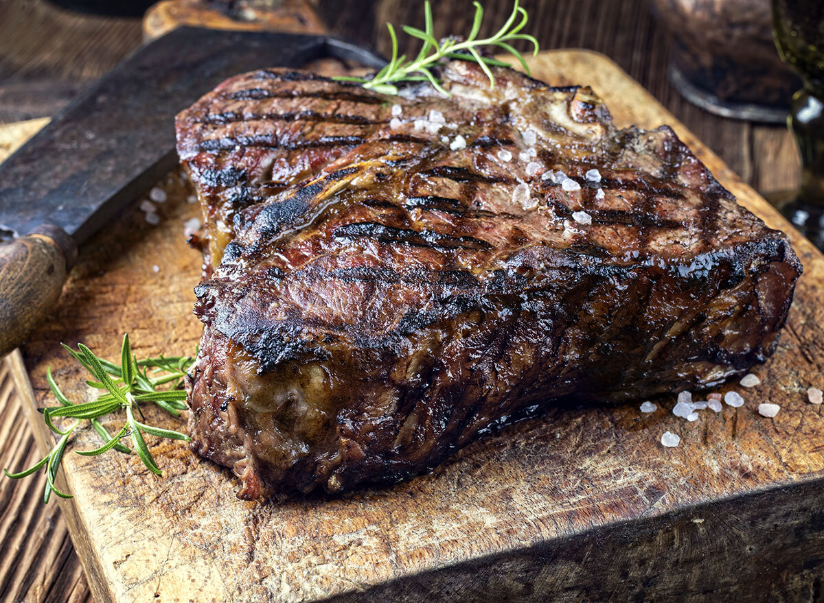 dry ages barbecue porterhouse steak on cutting block