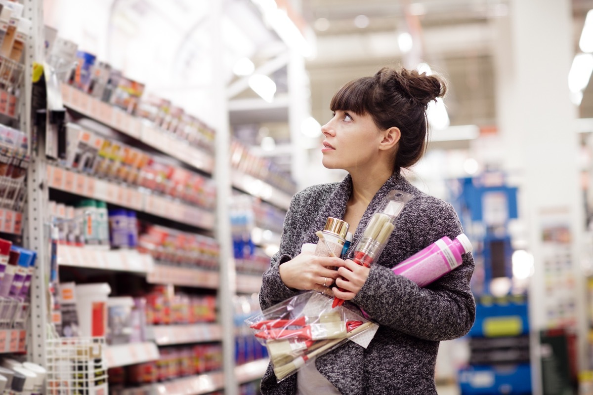 Woman picking out paint and craft supplies