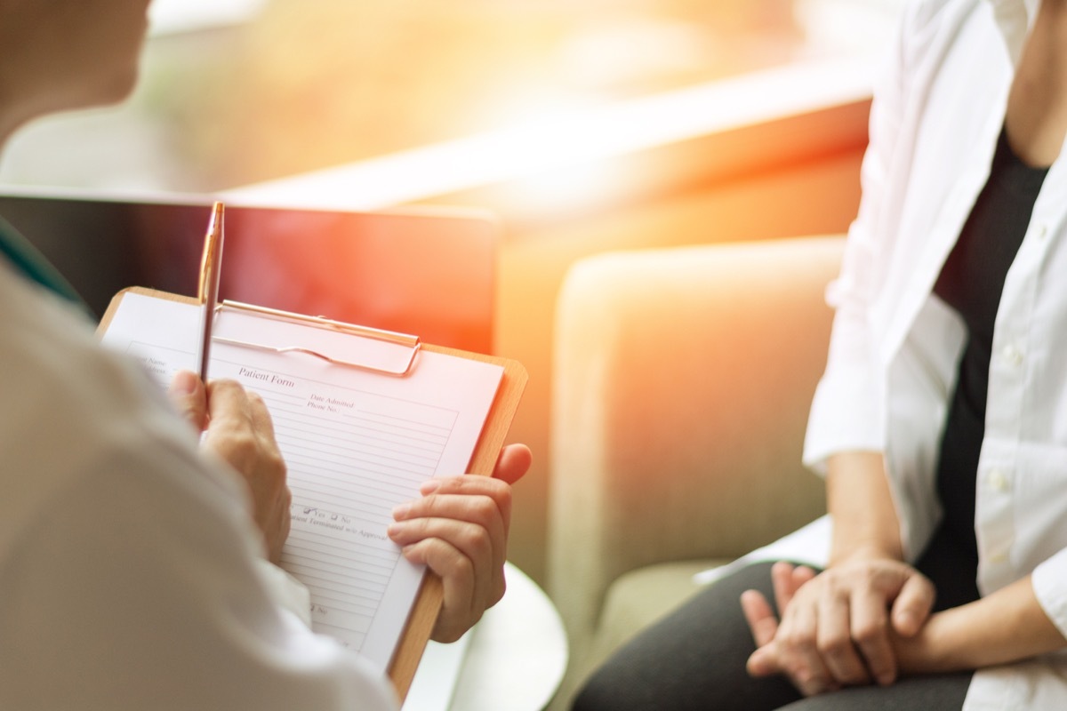 Woman Sitting Down Talking to Her Doctor Stop Lying to Your Doctor