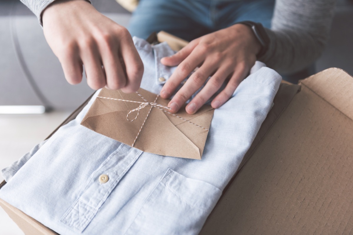 man opening shirt gift