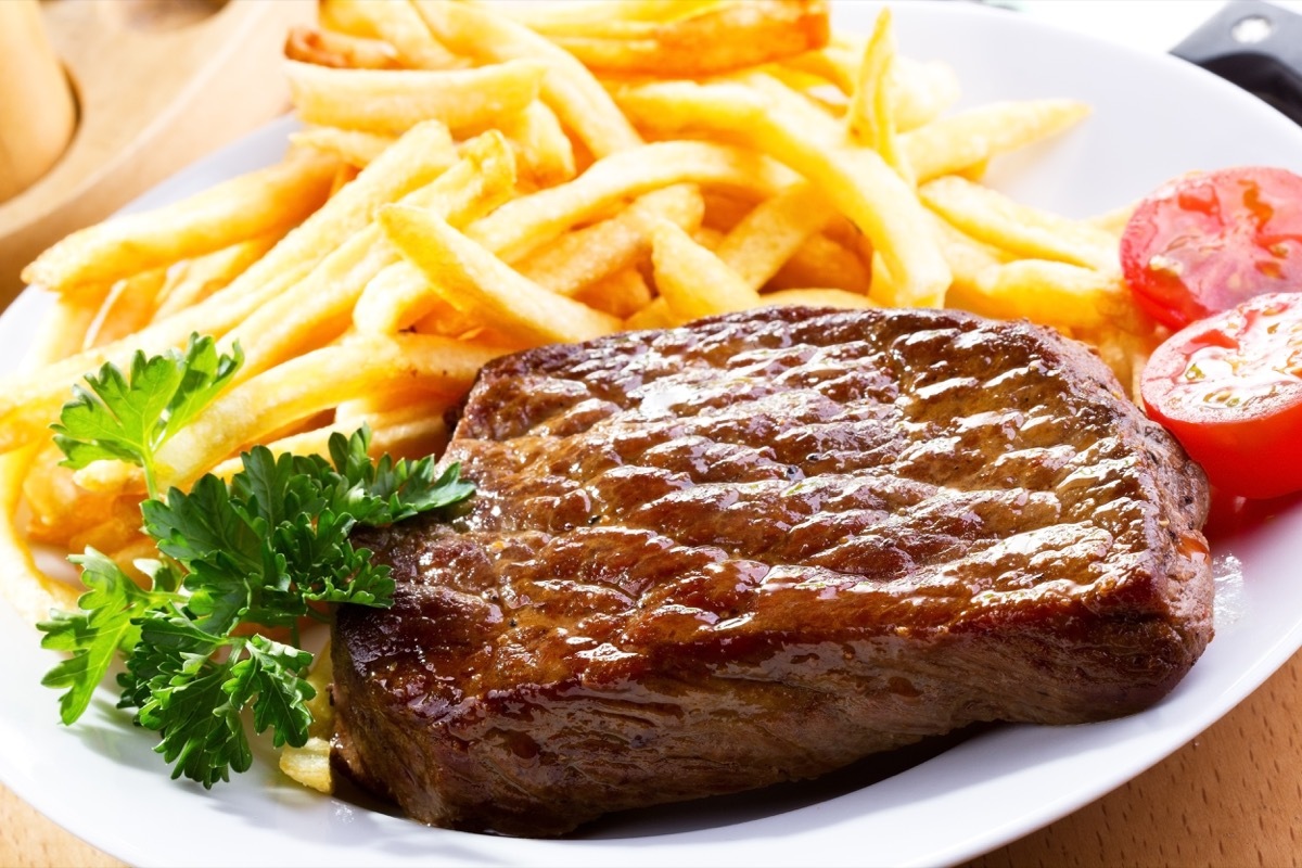 grilled steak and fries in a plate